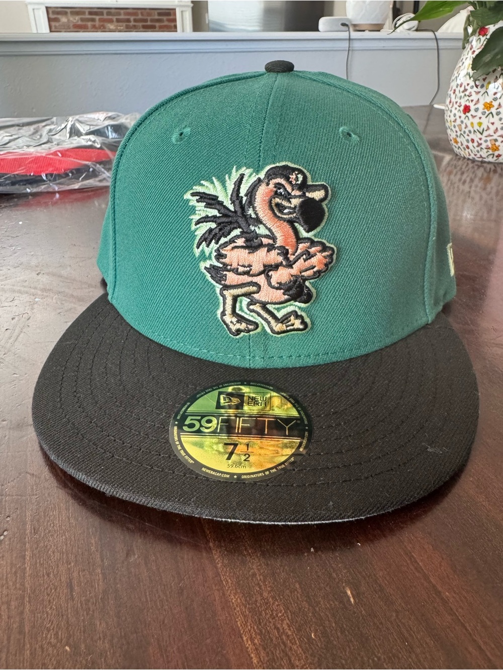 The Clink Room New Era Teal & Black Fitted Hat with fighting flamingo